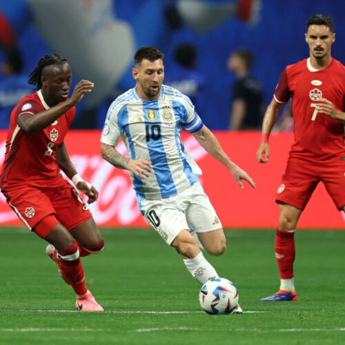 Canada's midfielder #08 Ismael Kone (L) fights for the ball with Argentina's forward #10 Lionel Messi during the Conmebol 2024 Copa America tournament group A football match between Argentina and Canada at Mercedes Benz Stadium in Atlanta, Georgia, on June 20, 2024. (Photo by CHARLY TRIBALLEAU / AFP) (Photo by CHARLY TRIBALLEAU/AFP via Getty Images)